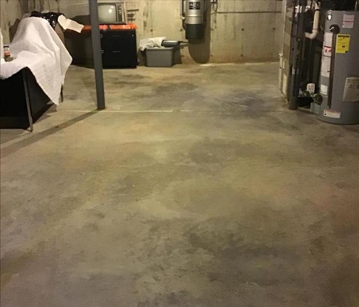 after water damage services have been provided. no water on concrete floor, completely clean