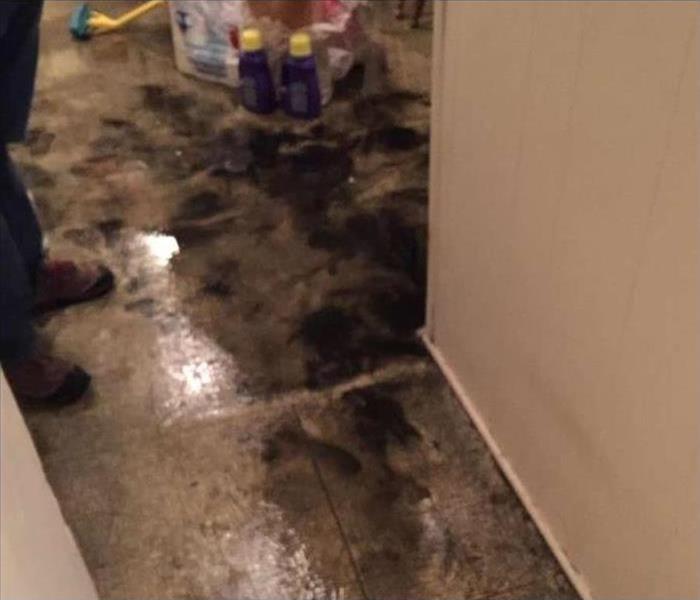 water and sewage on a tile floor