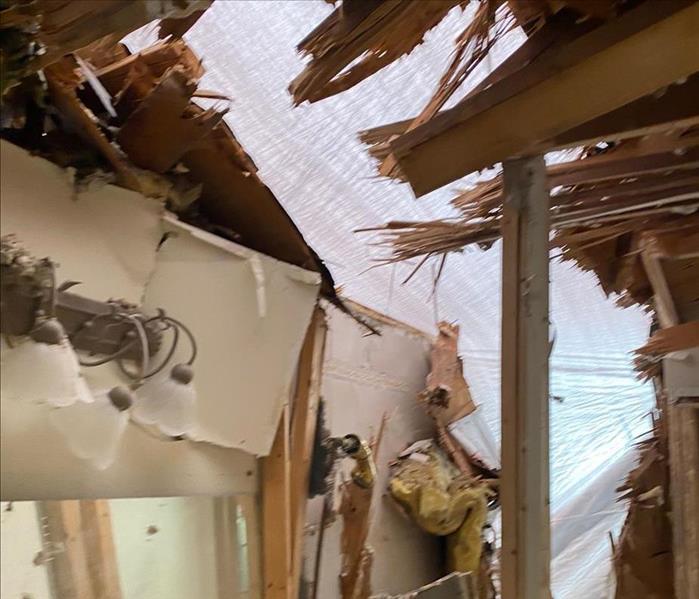 extreme damage from tornado demolishes bathroom because tree fell on home