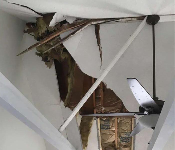 a large branch went through the roof after a bad storm and heavy rains