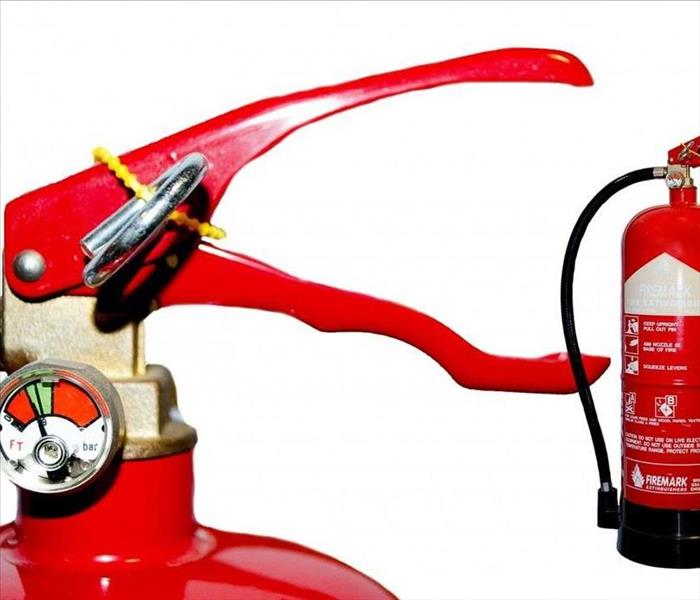 Close up of top of fire extinguisher and full shot of extinguisher on right side of picture