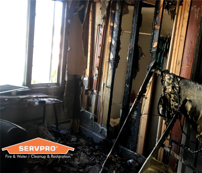 fire damage in a home with servpro logo