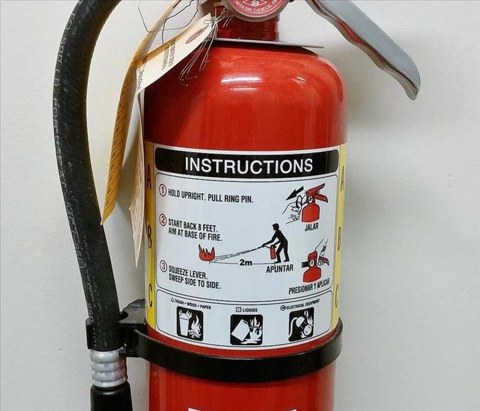 fire extinguisher hanging on wall