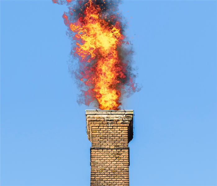 fire shooting out of chimney from creosote lighting on fire